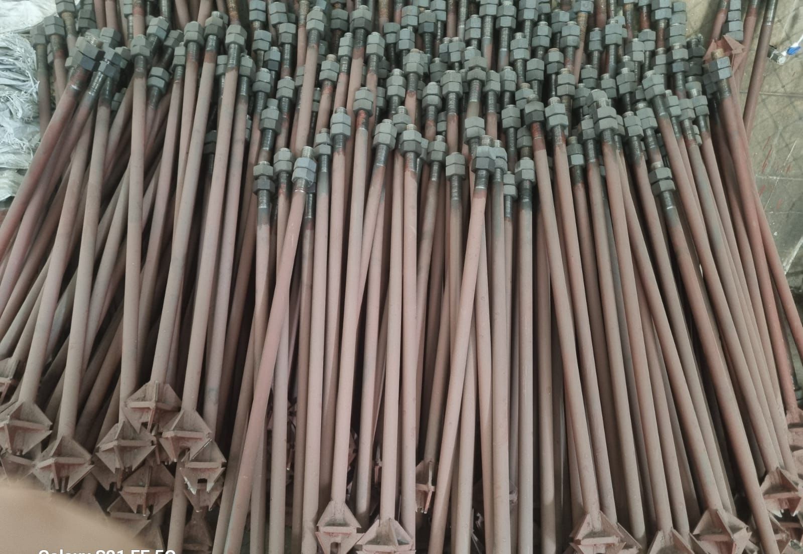 Welded plate foundation bolt assemblies with base plate, triangular stiffener gussets and heavy hex nuts fitted